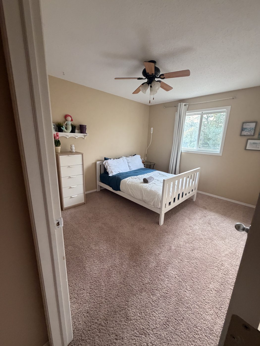 Freshly cleaned bedroom with made bed